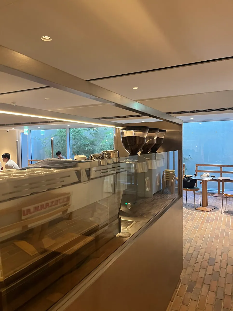 Bar with a La Marzocco machine and bean grinder