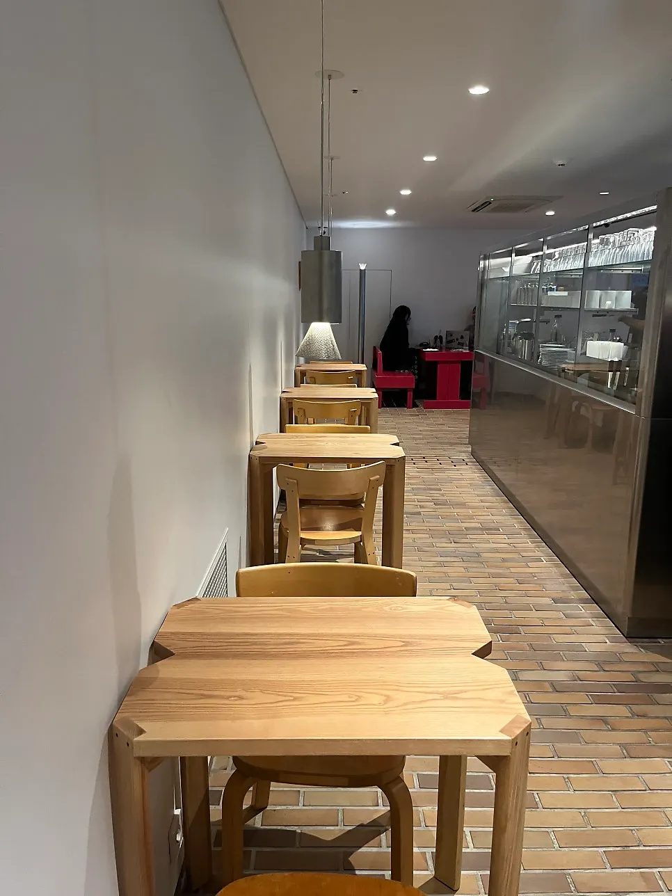Table with a V-shaped groove and a wooden chair with a backrest