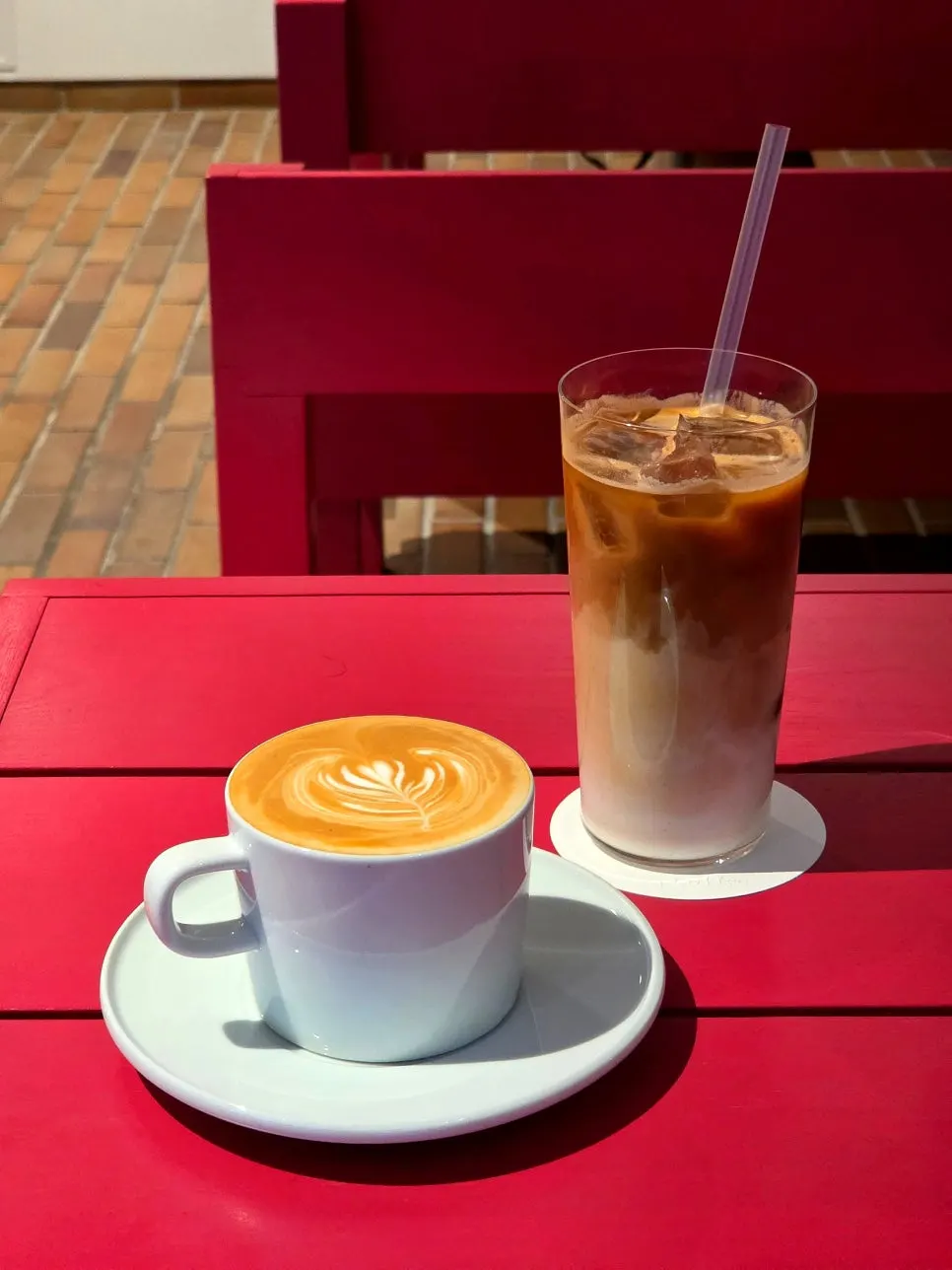 Hot and iced café lattes placed on a table