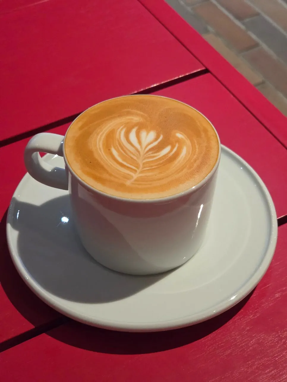 A cup of hot café latte at T Coffee