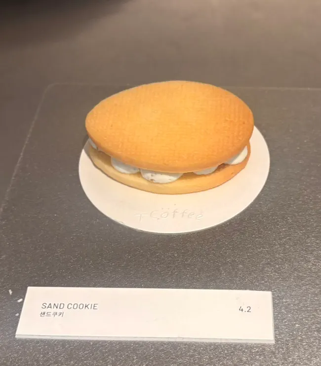 Dessert showcase with cheesecake and cream choux visible