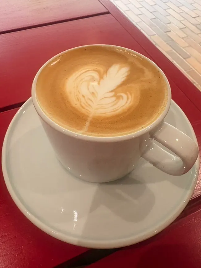 Close-up of almond latte topped with smooth foam