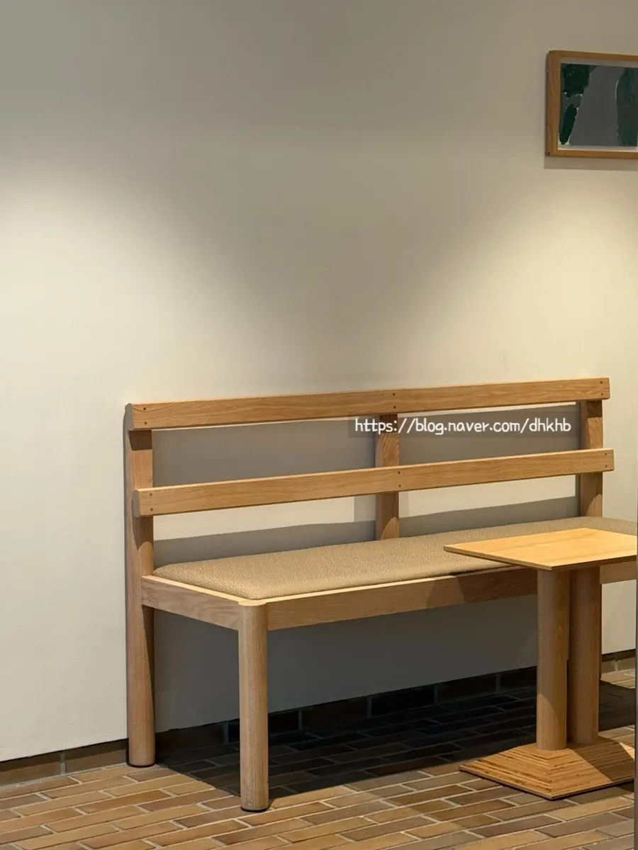 Wood-tone seating inside T Coffee
