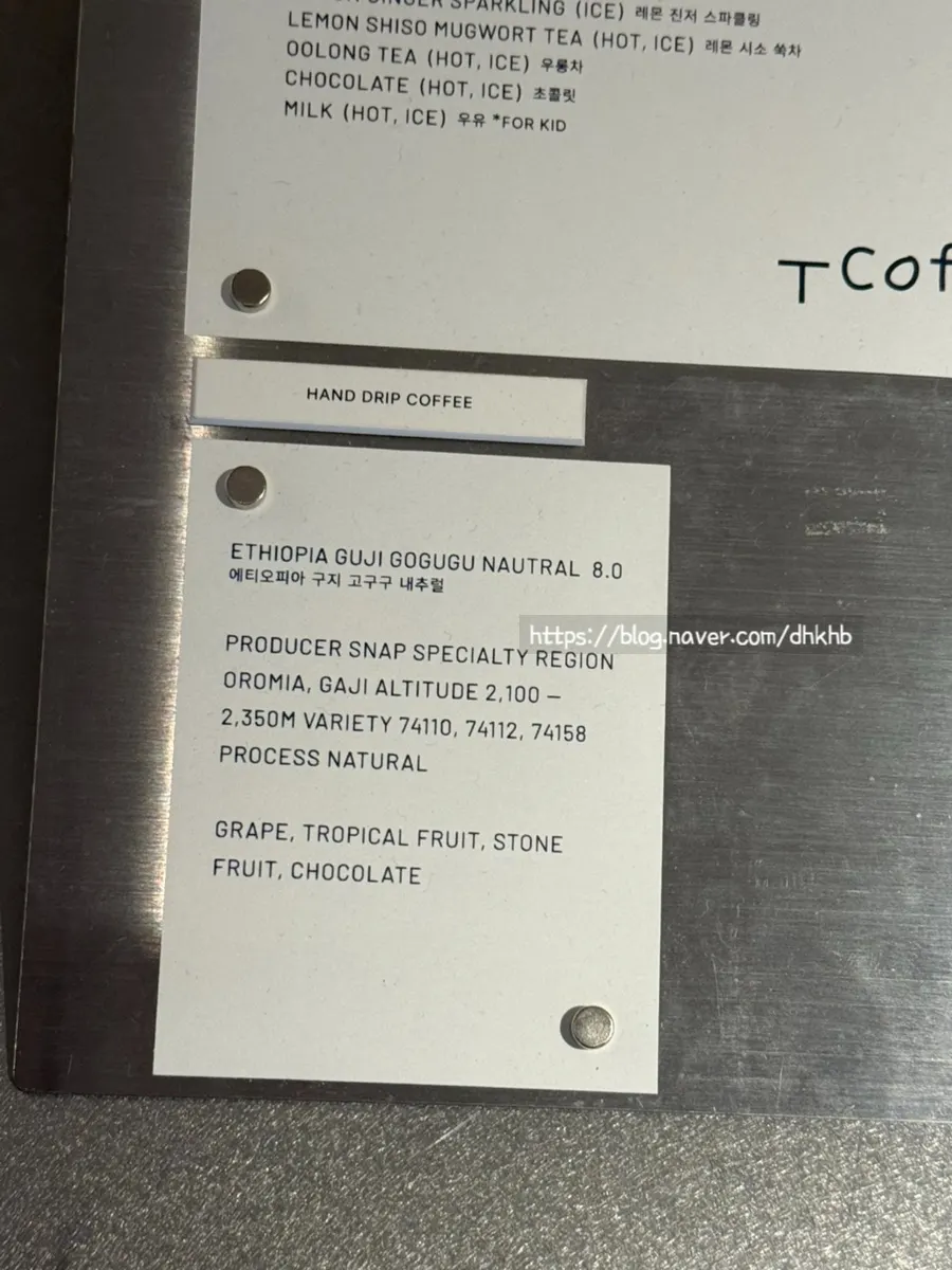 T Coffee's coffee and non-coffee menu board with prices