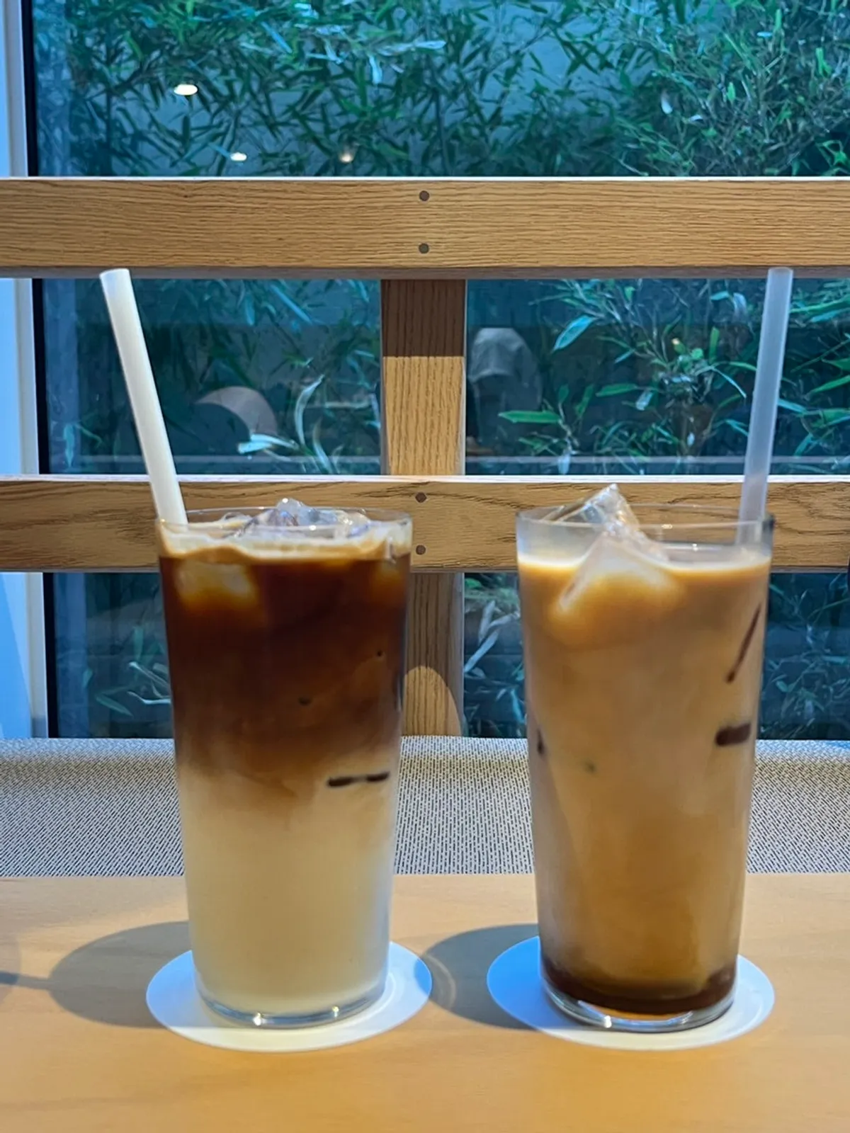 Holding the vanilla cream cold brew and almond latte