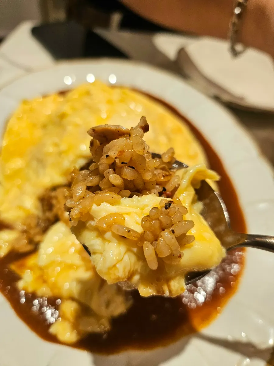 Soft omelet cut open by a staff member
