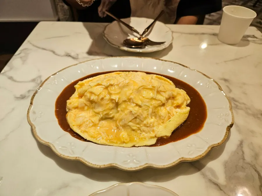 Omelet rice with house-made sauce and fried rice