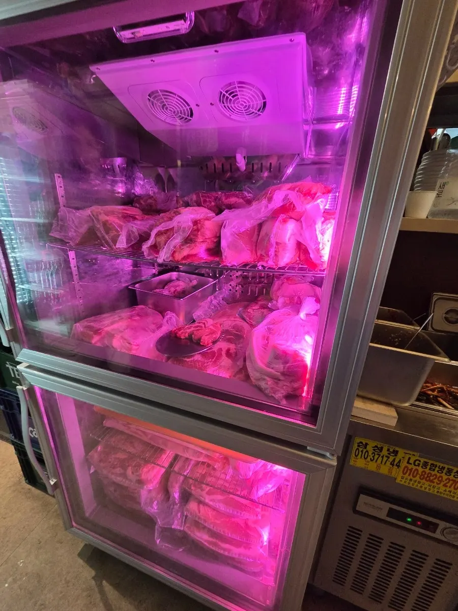 Pork aging fridge at the store entrance