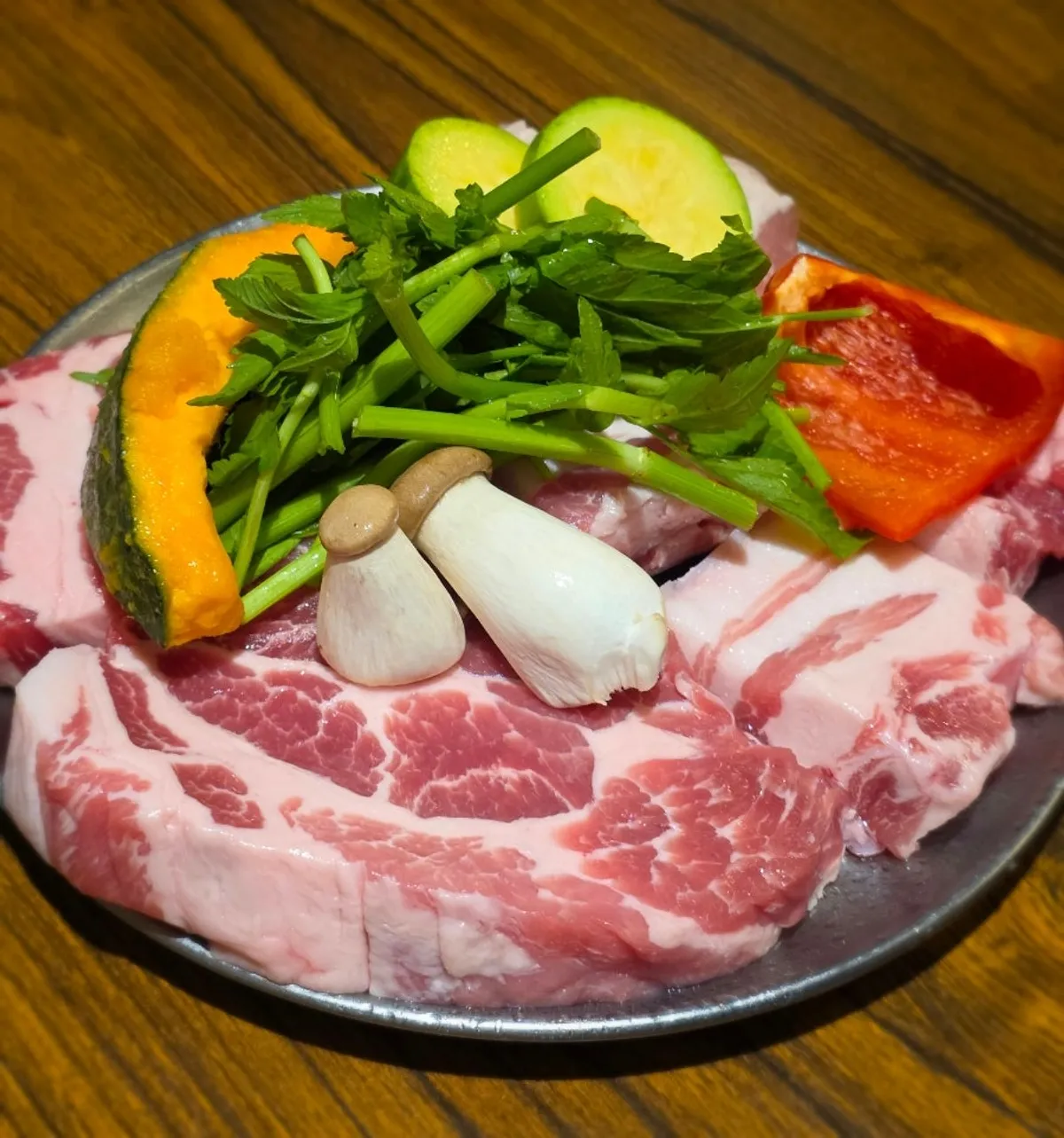 Table set with Seongsu Teojeon's pork belly and side dishes
