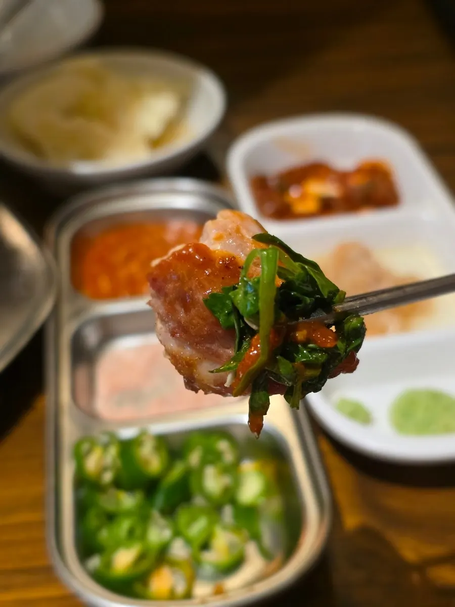 Pork neck held with chopsticks