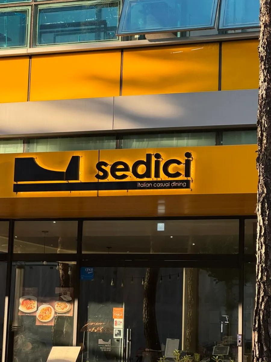 Sedici's exterior in Seongsu with evening sunlight on a weekday