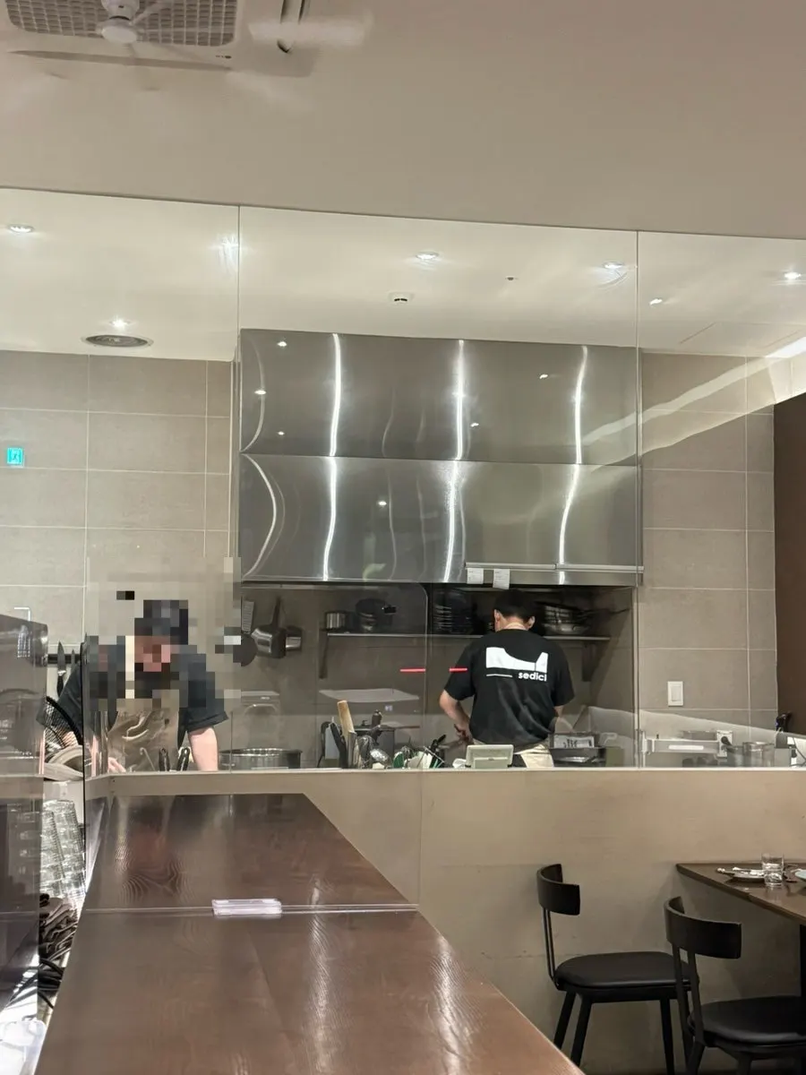 Sedici's open kitchen where cooking is visible