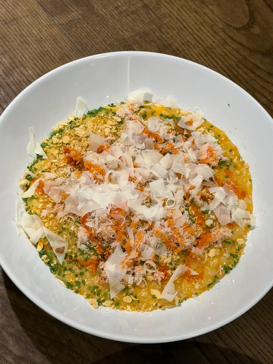 A plate of risotto rich with crab flavor