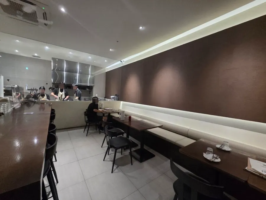 Sedici's softly lit open kitchen