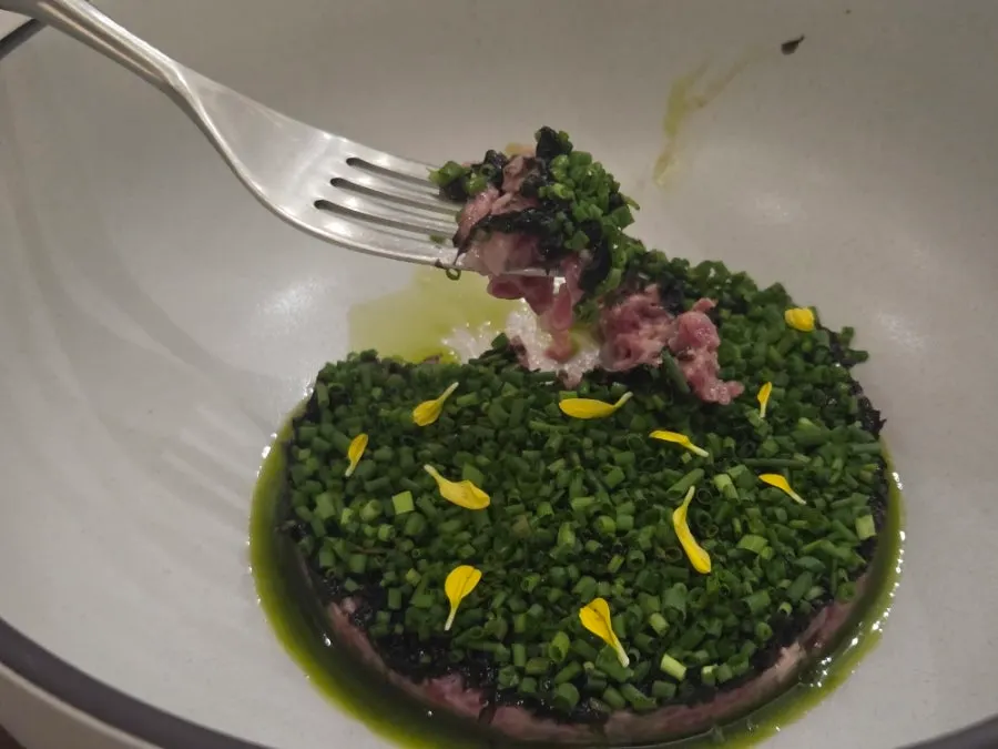 Beef tartare topped with gim pesto and chives