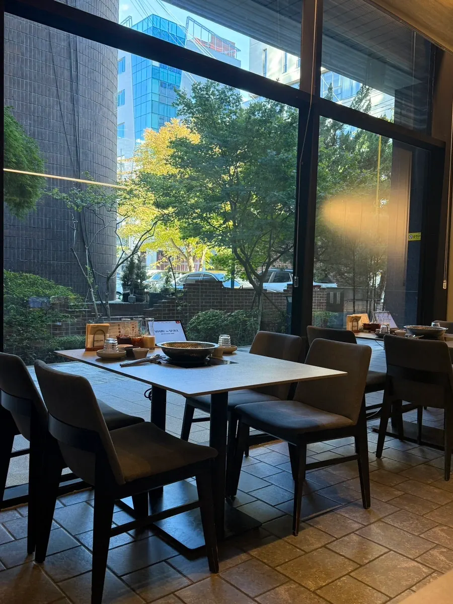 Restaurant space with moss and stone plant décor