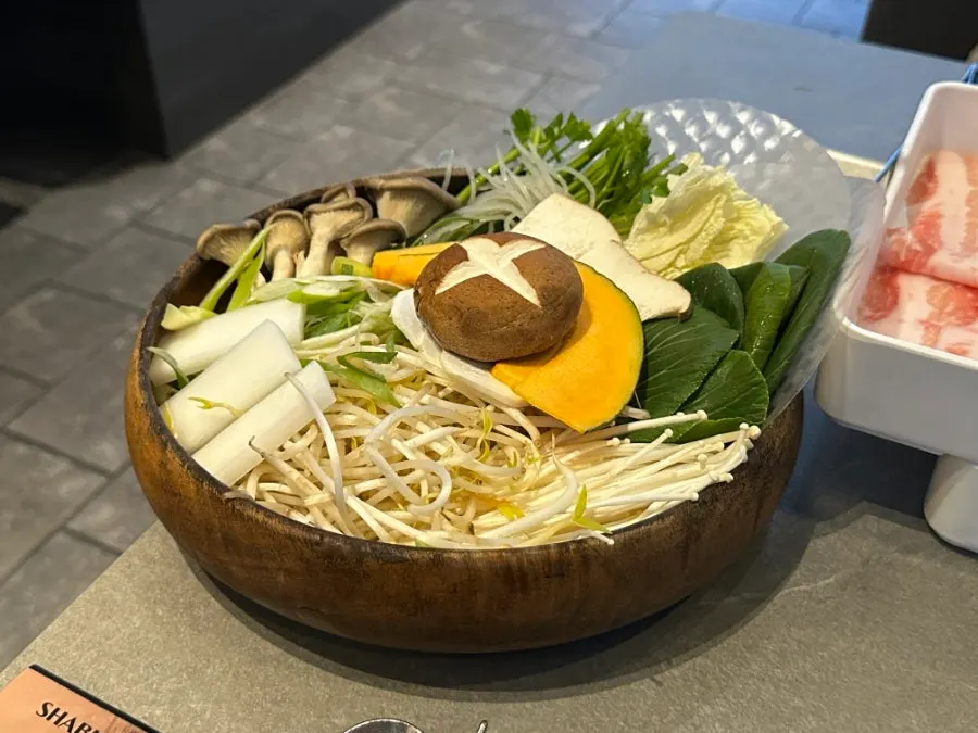 Shabu-shabu pot simmering with vegetables