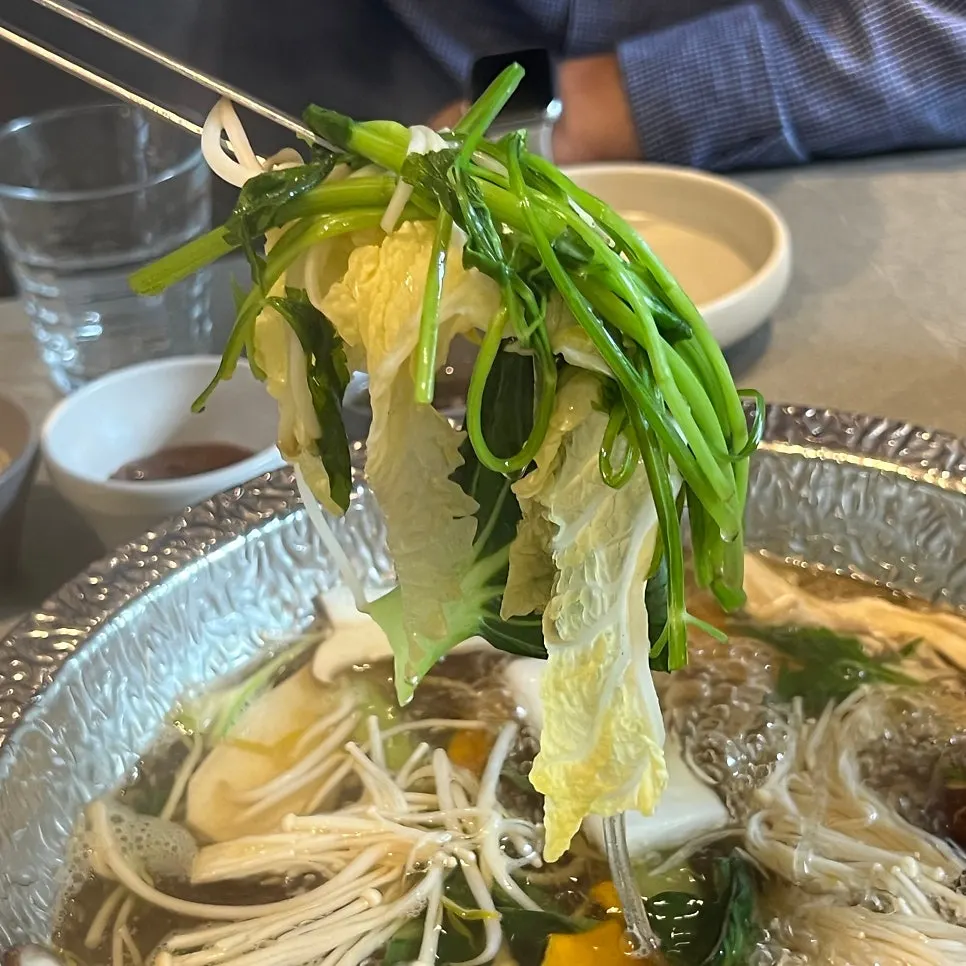 A piece of wagyu ggotdeungsim cooked in the broth