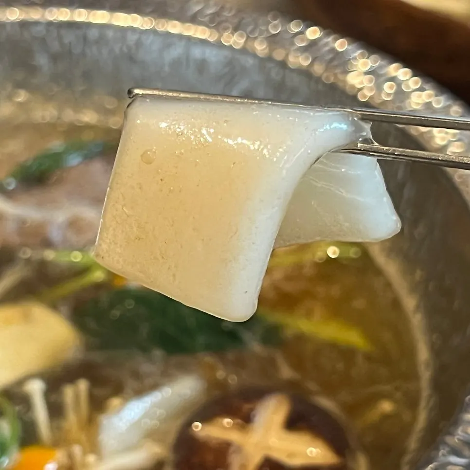 A rice paper wrap being made