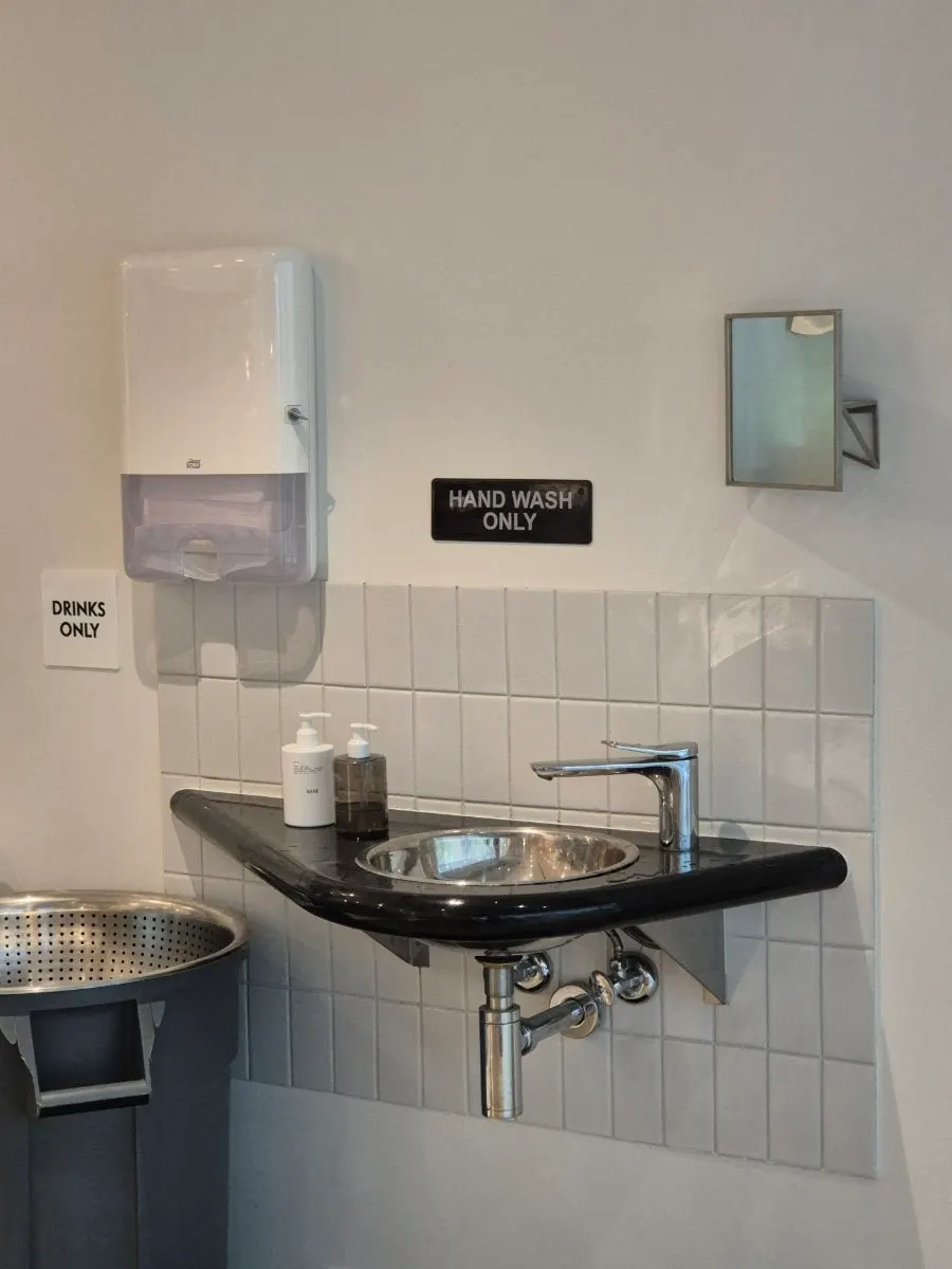 Open kitchen where pizza is visibly being baked