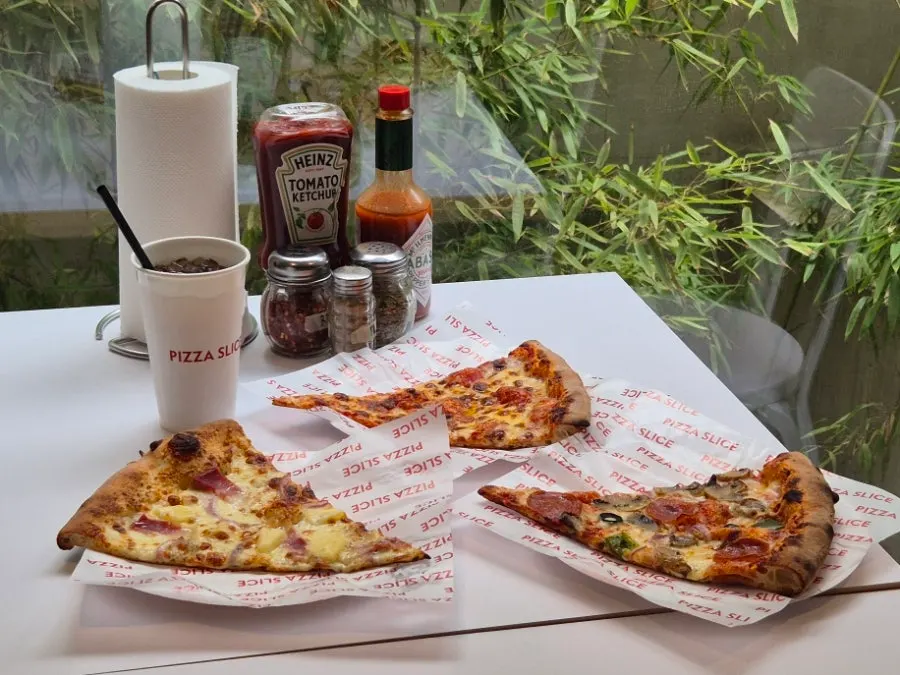 Table setting with pizza and drinks together
