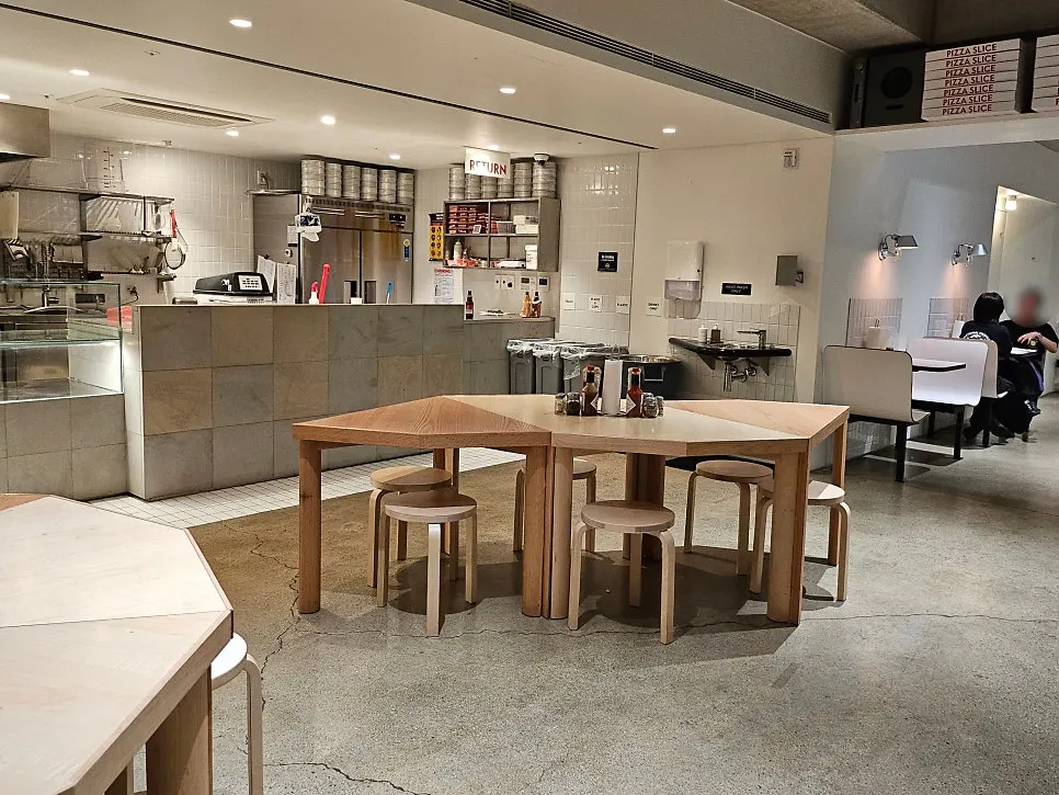 Quiet interior of Pizza Slice Seoul right before closing time