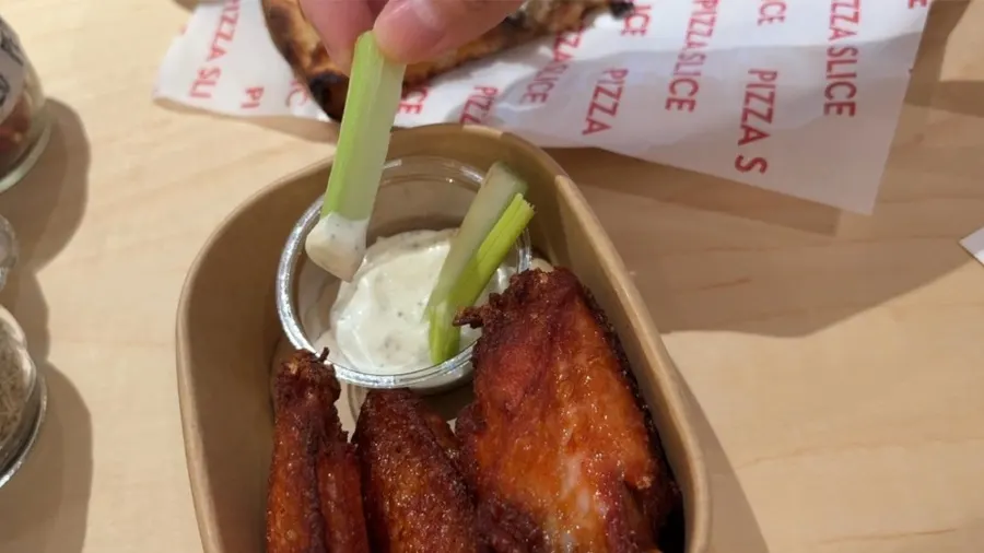 Celery and mayo sauce served alongside the buffalo wings