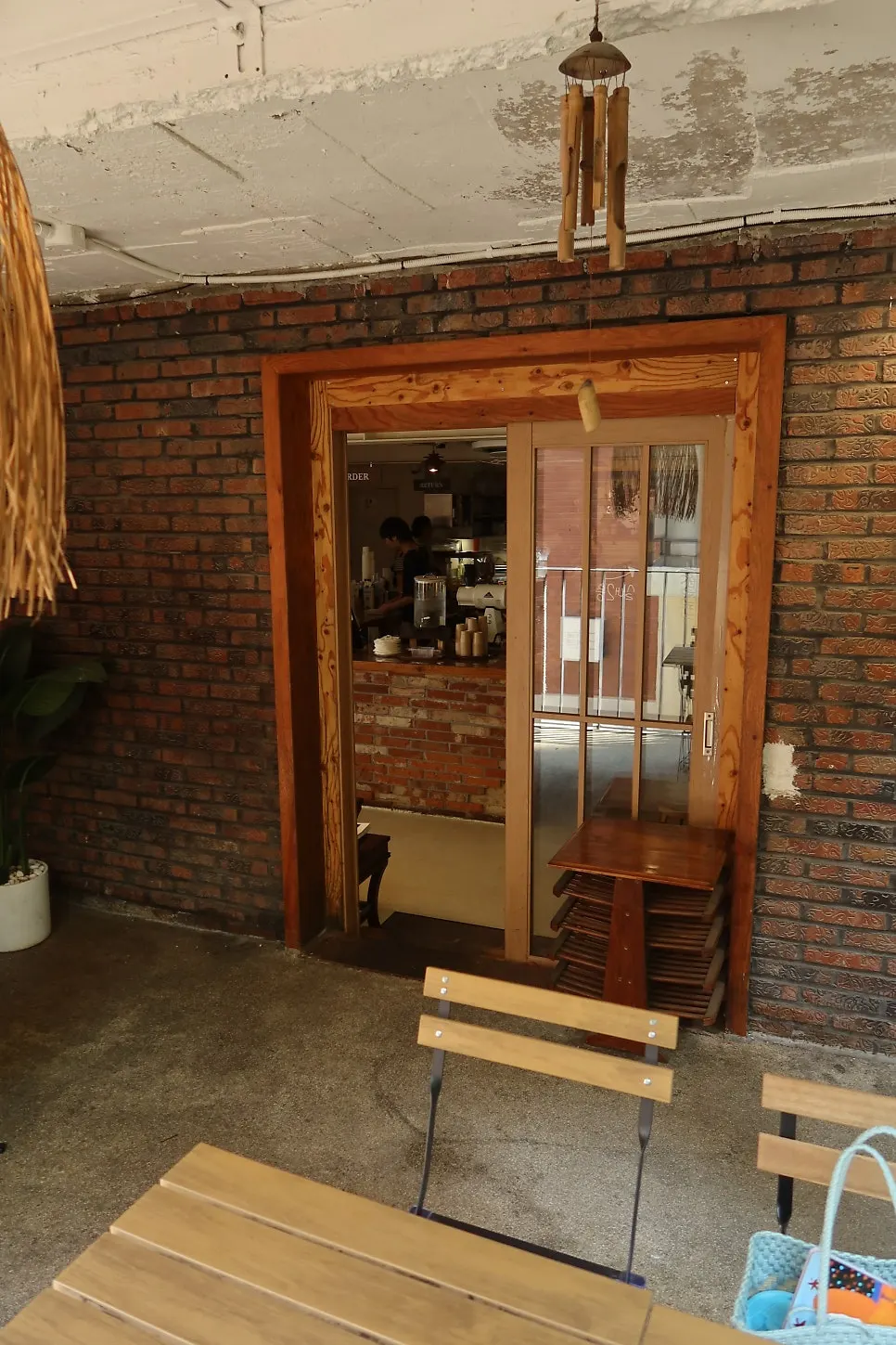 Café interior with wood-tone table seating