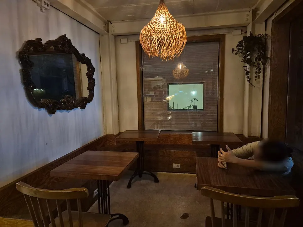 Corner of the café with TV feature notice posted