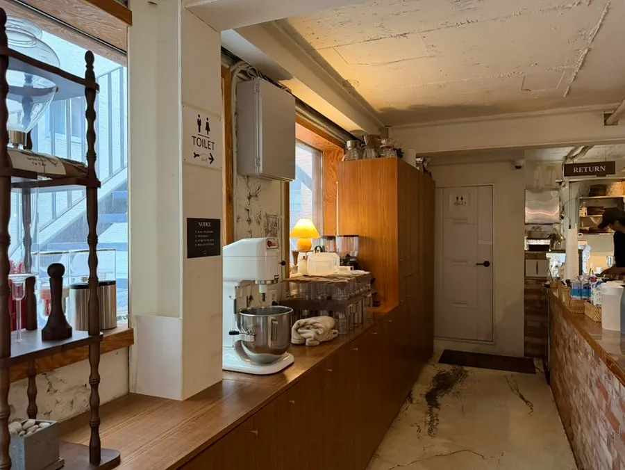 Antique furniture and lamplight on 5to7's first floor