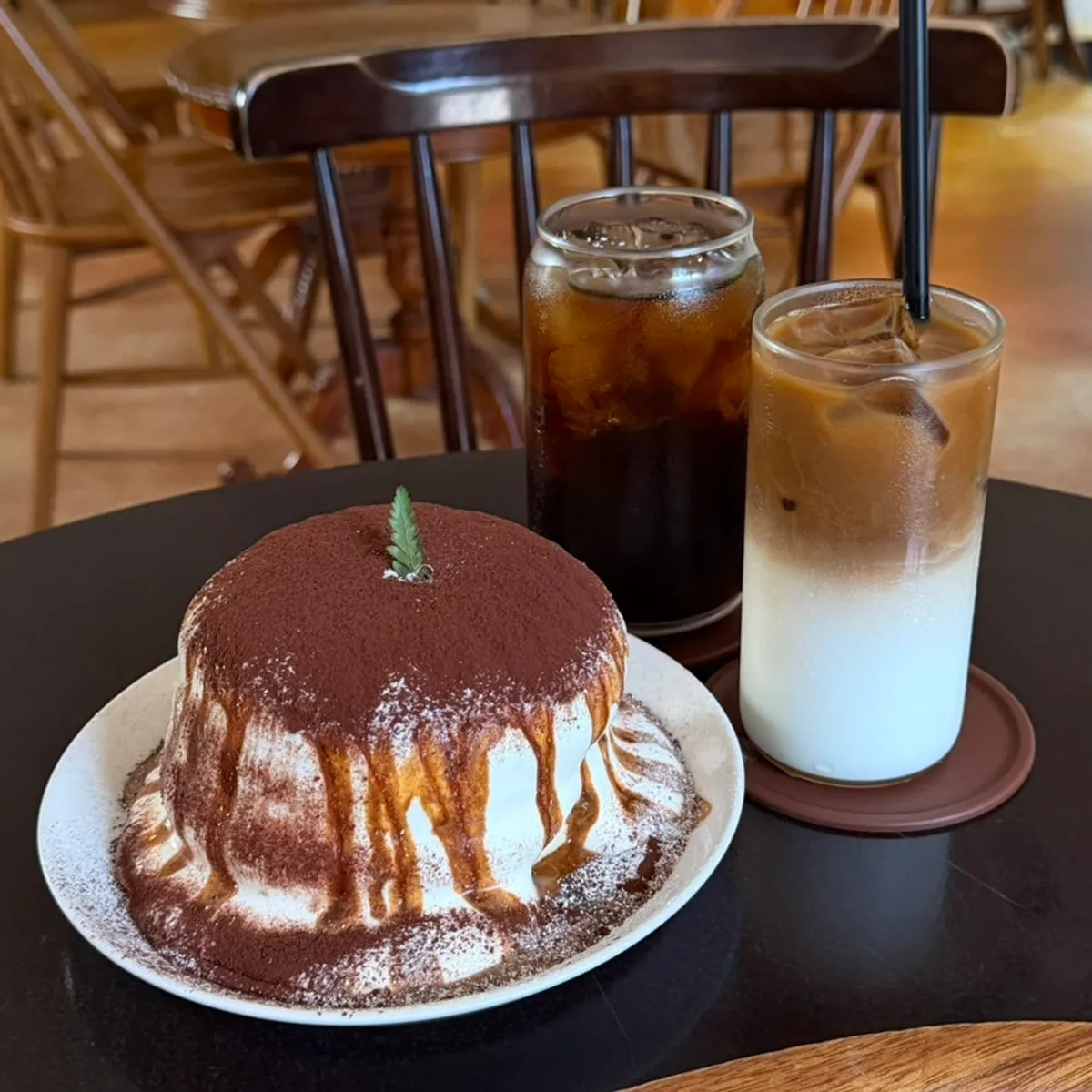Tiramisu soufflé with americano and vanilla latte