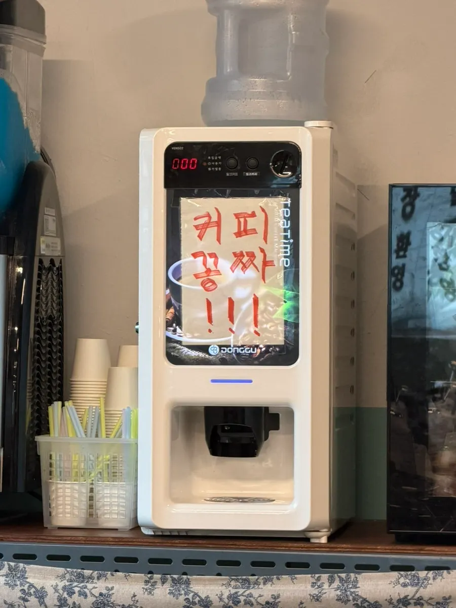 Self-serve corner with yogurt drinks for dessert