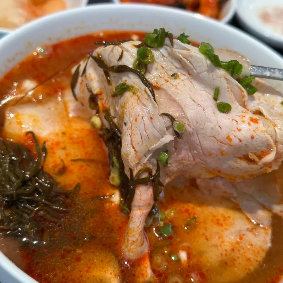 Pork coated in the spicy broth