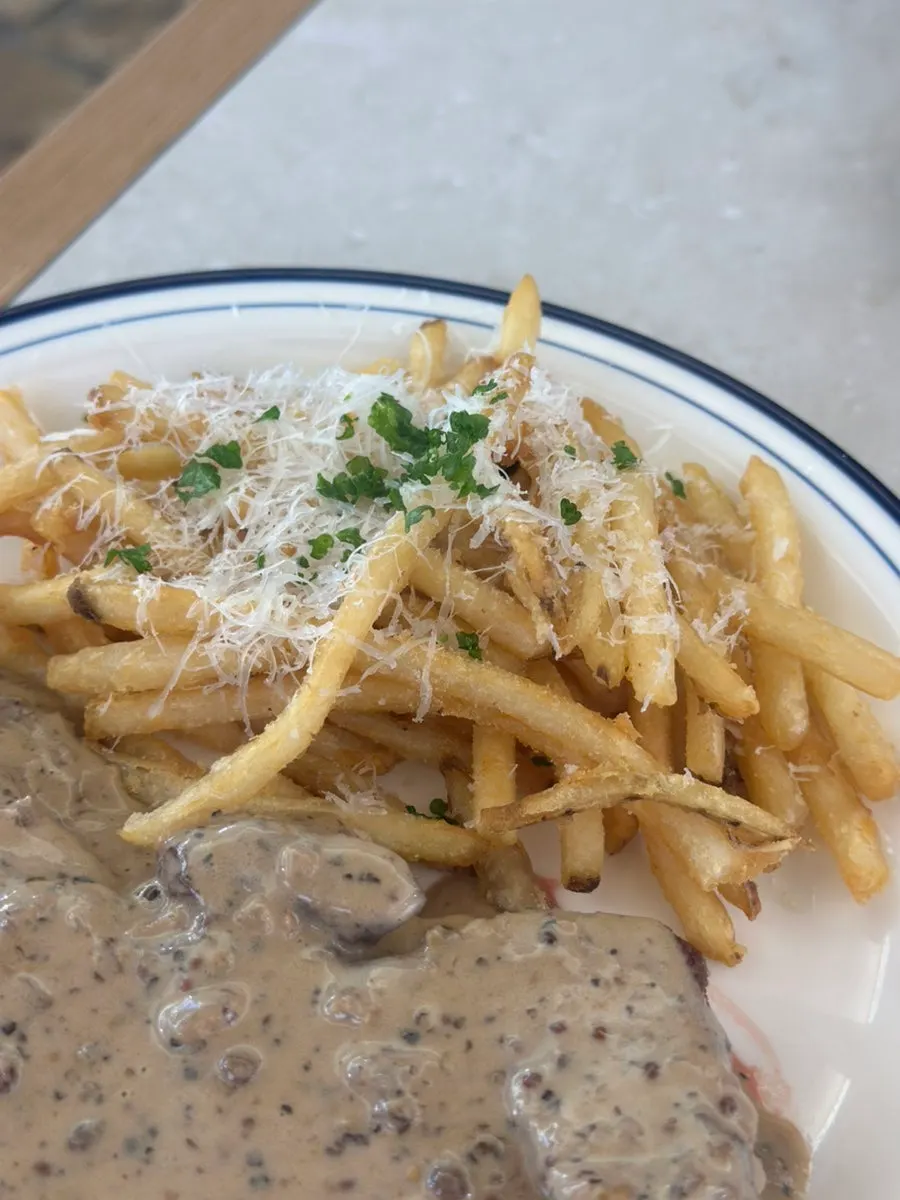 Fries served alongside the steak