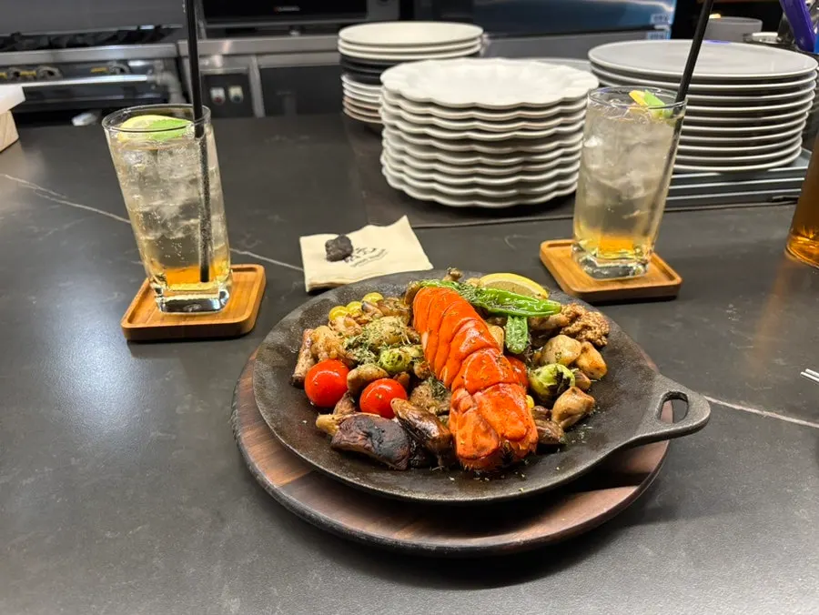 Whole lobster butter grill on a hot plate