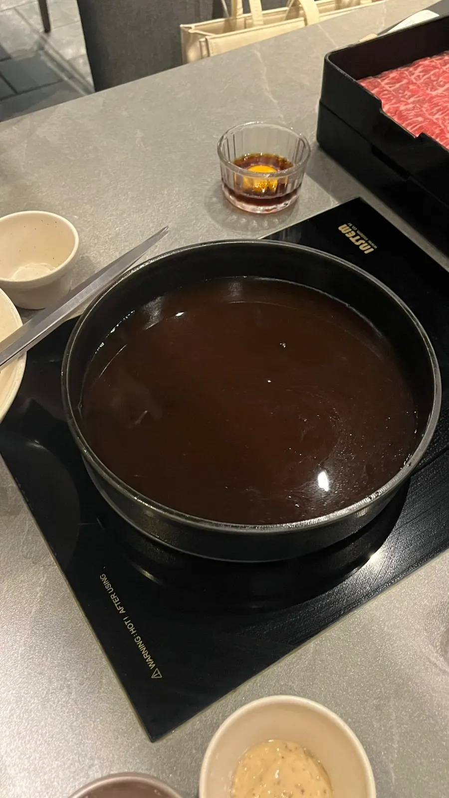 Sukiyaki cooking in its dedicated pan