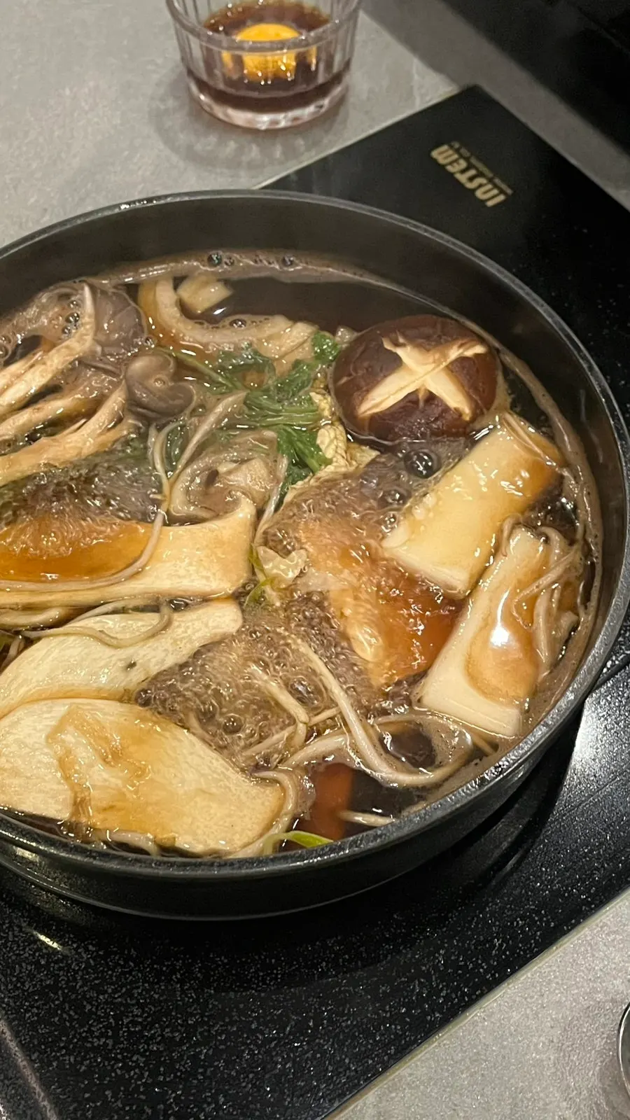 Vegetables added into the boiling broth