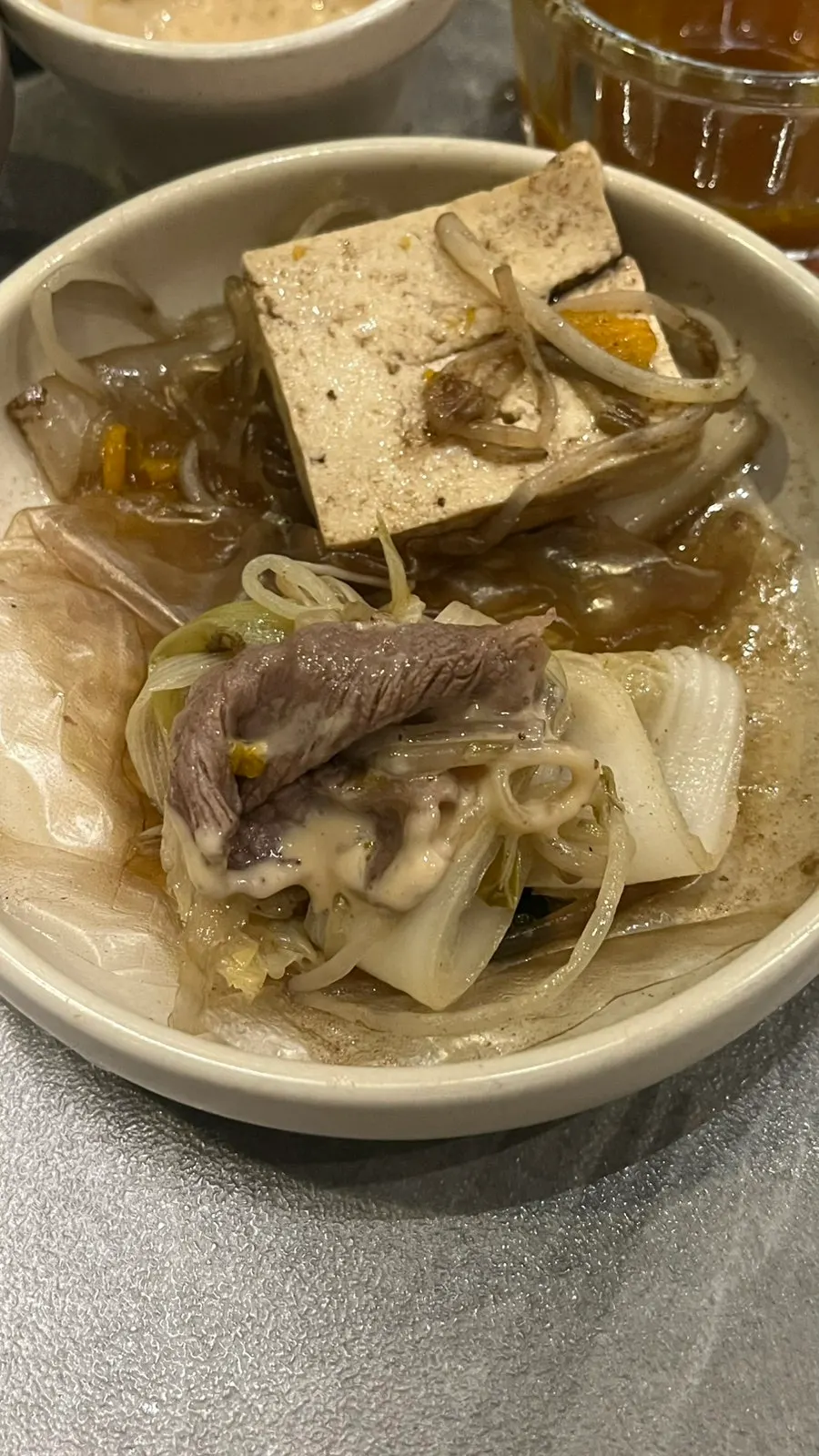 Meat and vegetables piled on a sheet of rice paper