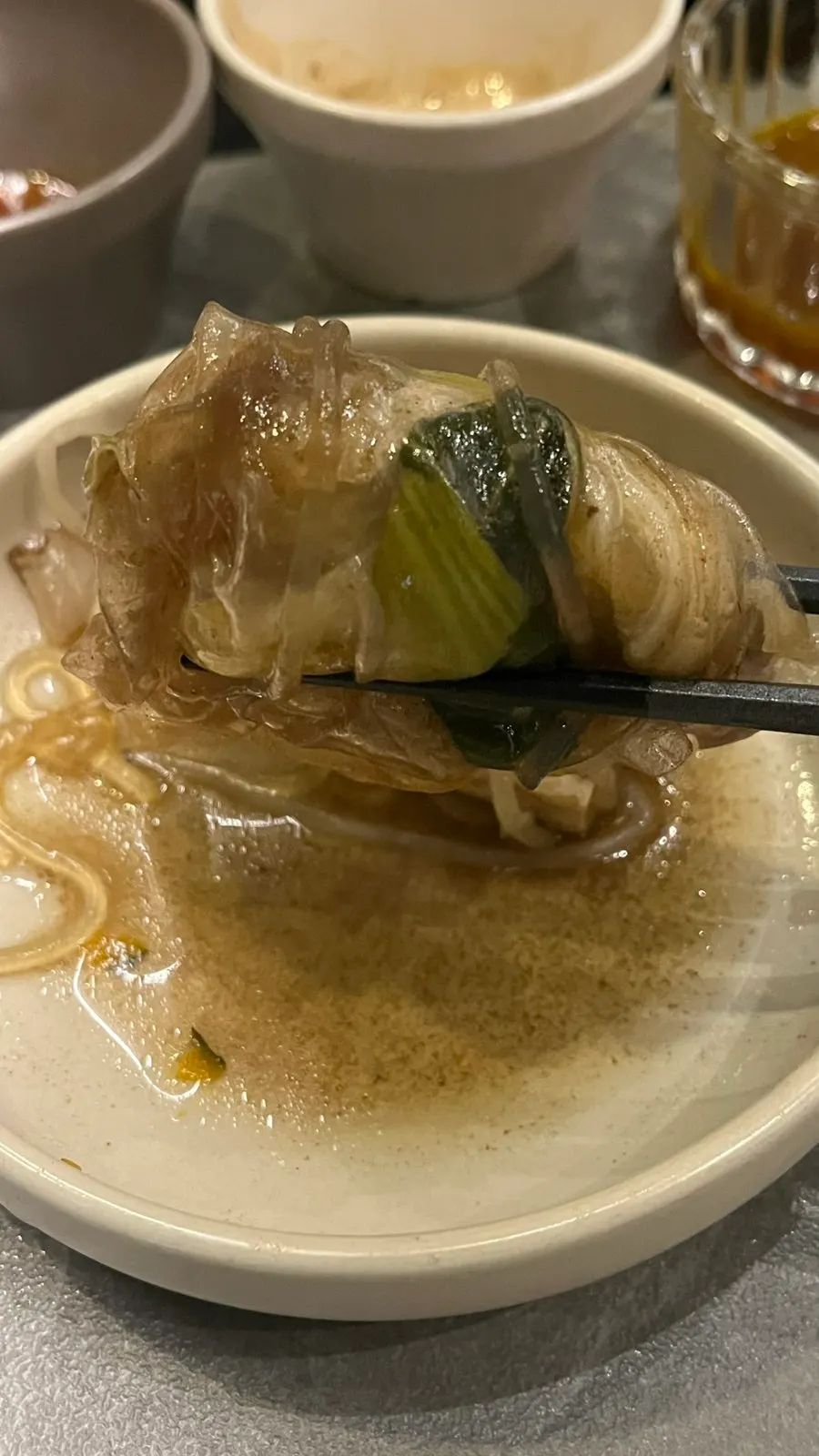 A bite of shabu-shabu wrapped in rice paper