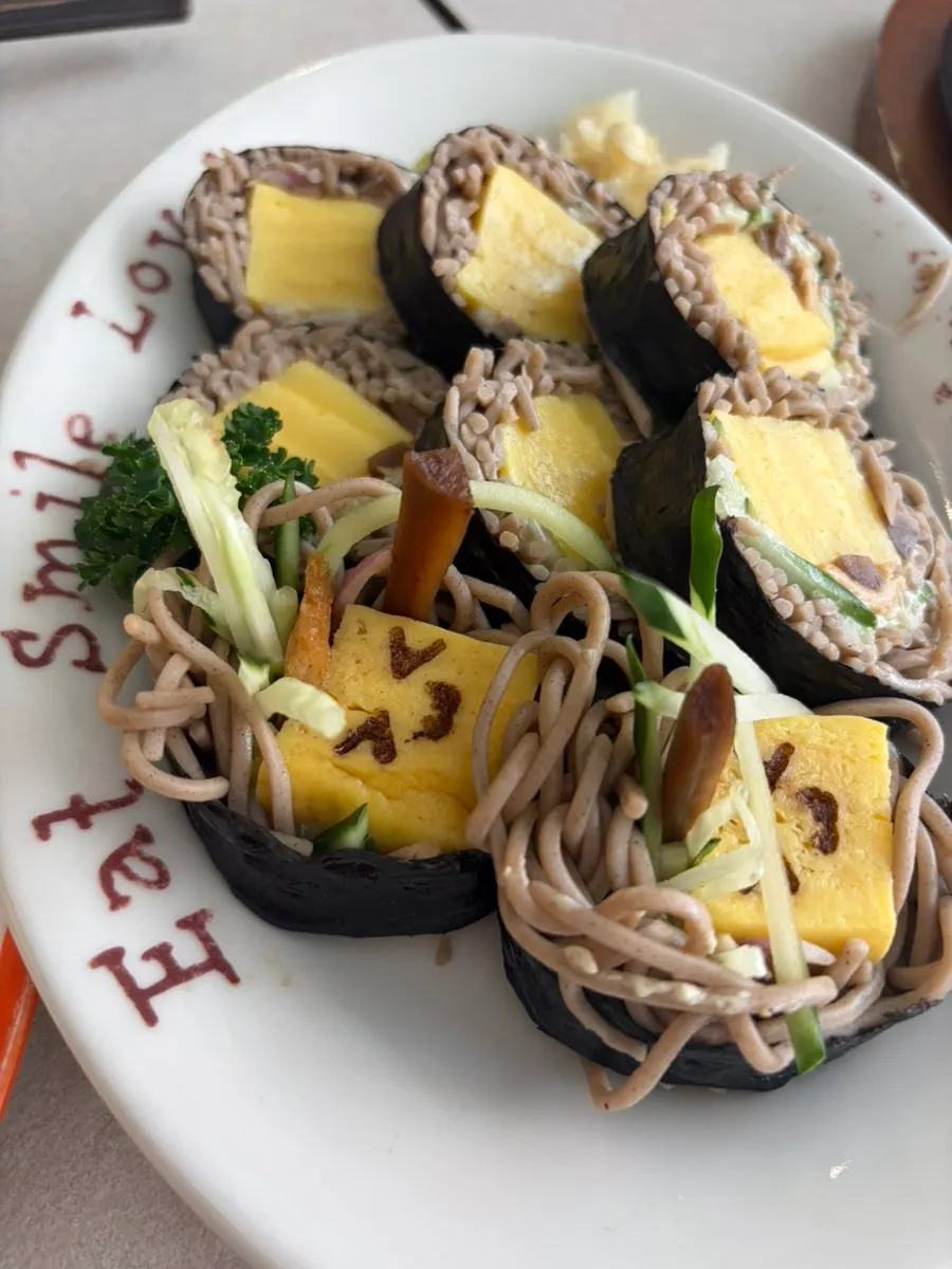 Cross-section of soba maki with buckwheat noodles and rolled egg