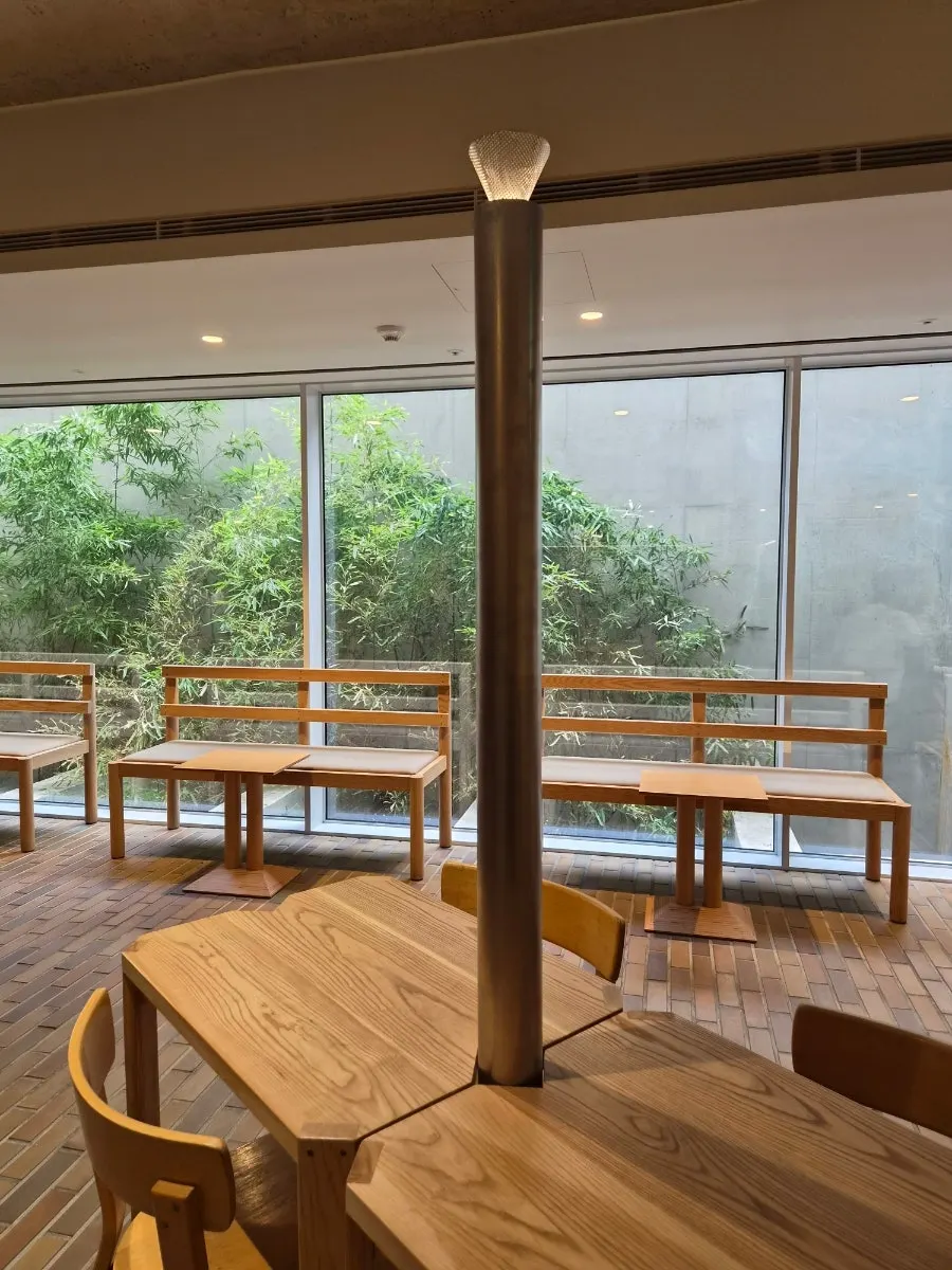 Window seat with bamboo visible through the glass