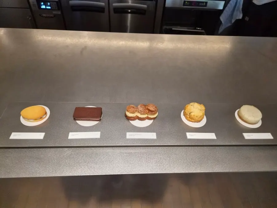 Dessert models and menu board in front of the counter