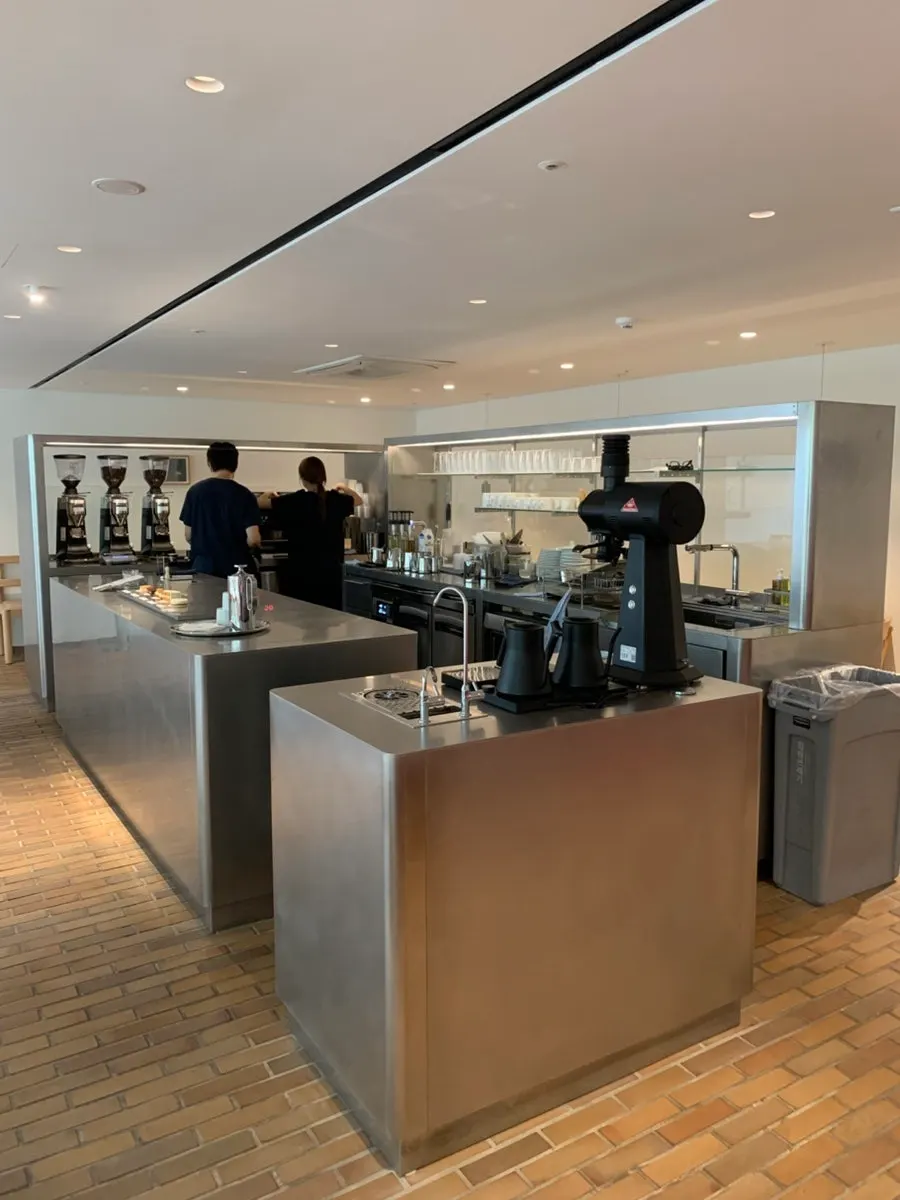 Silver-toned coffee bar in the middle of the store