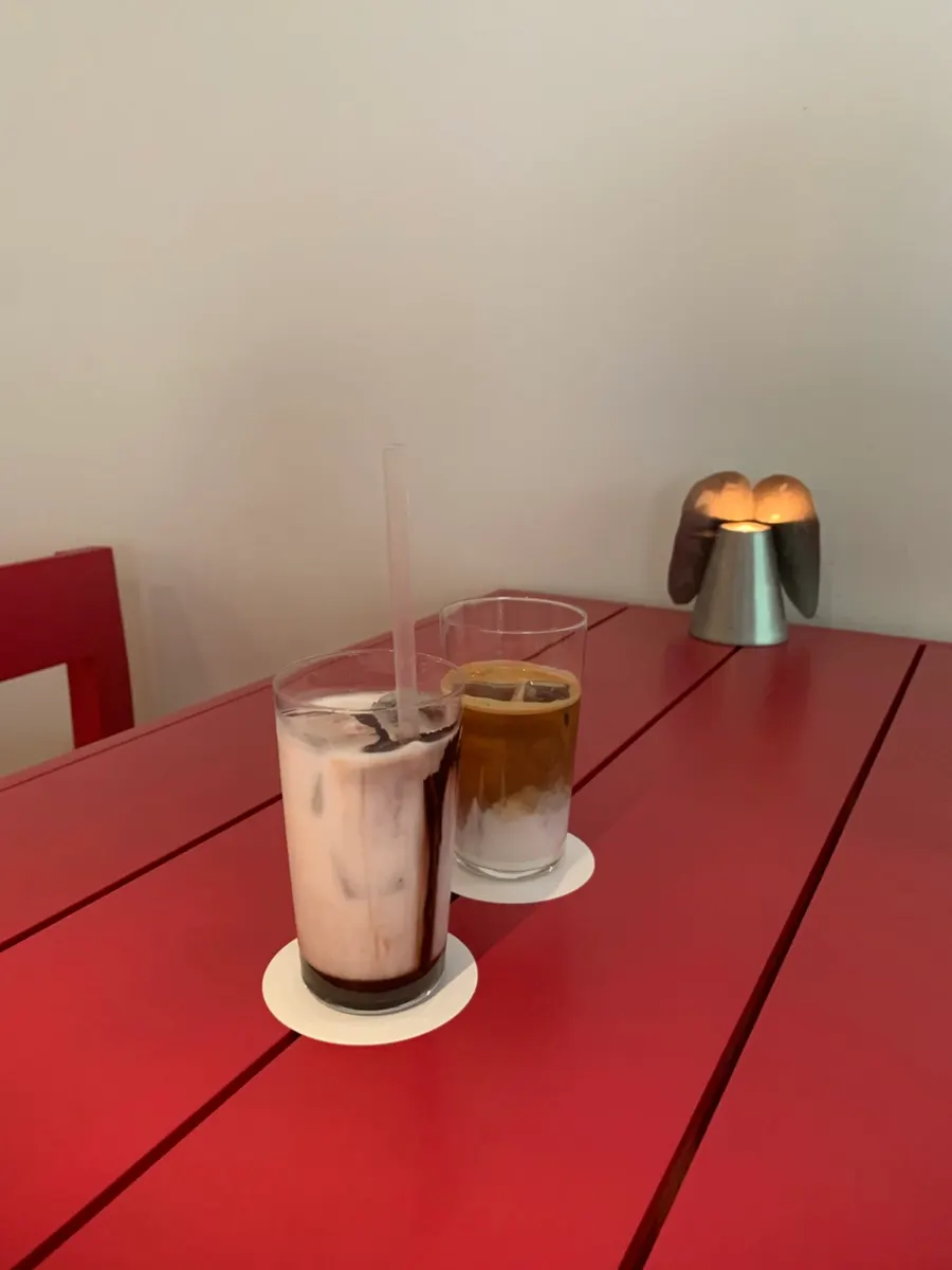 Two drinks placed on the colorful table