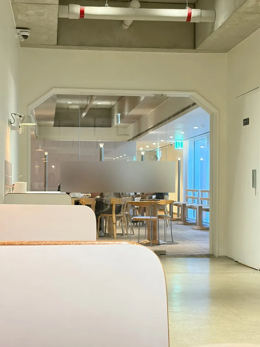White exterior entrance of T Coffee in Seongsu