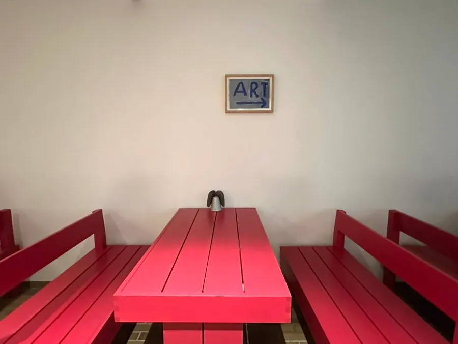 A long stretch of red table seating