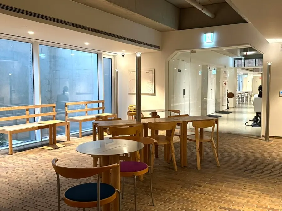 Wide café interior with wood-toned furniture