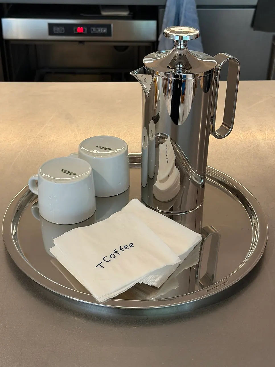 Neatly arranged cups and coffee machine