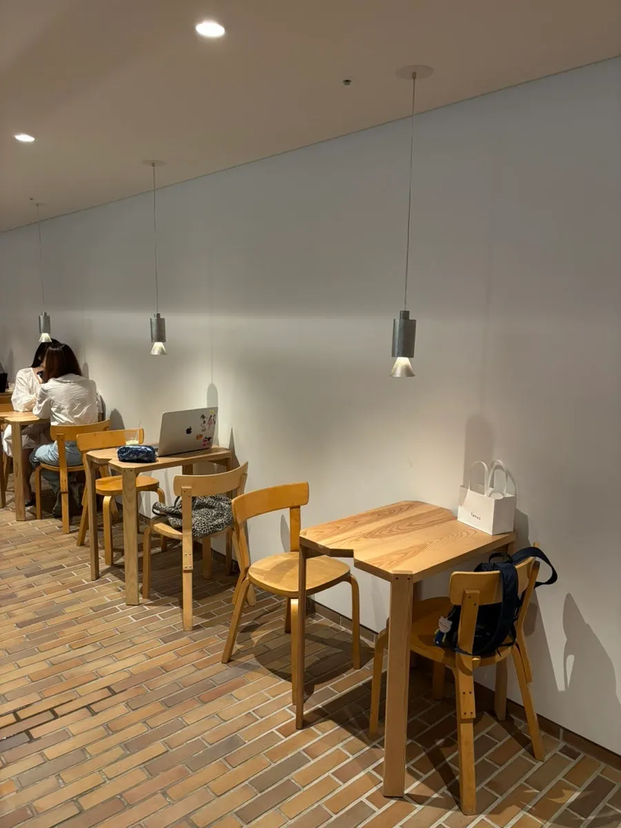 T Coffee's interior making use of light and furniture