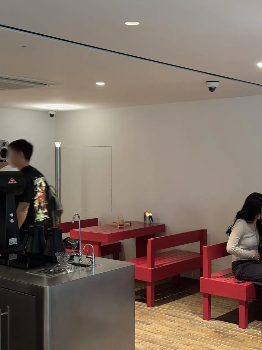 Minimal café space with accent color details